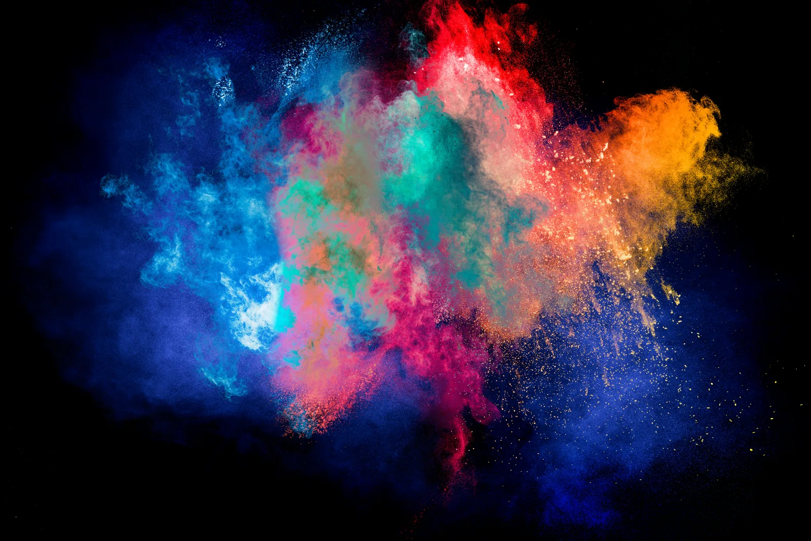 Clouds of coloured powder against black